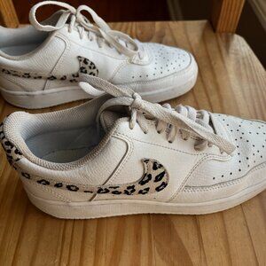 Nike low top white with leopard printo logo size 7.5